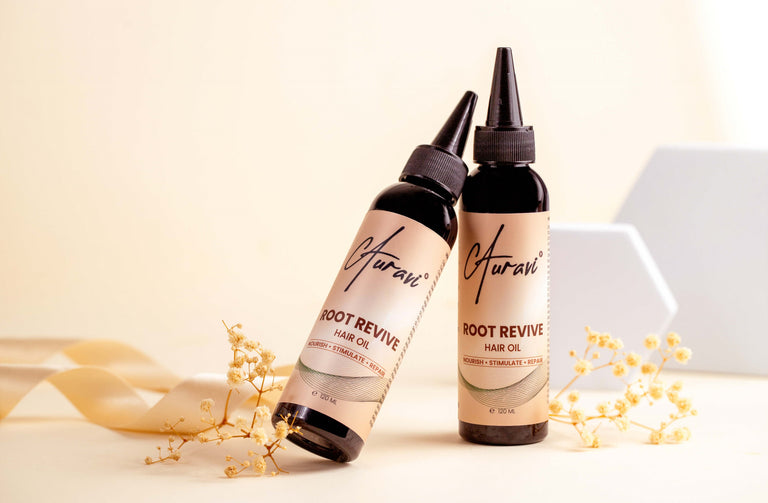 Close-up view of 2 Auravi Root Revive Hair Oil Bottles, designed for hair growth